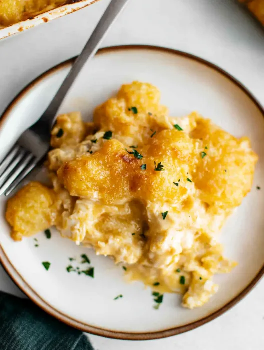 A plate of food with a fork on the side.