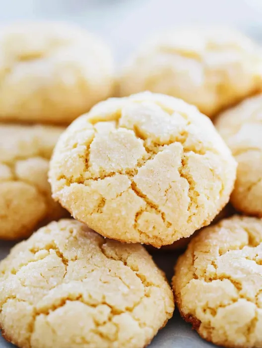 A close up of a cookie with a bite taken out of it.