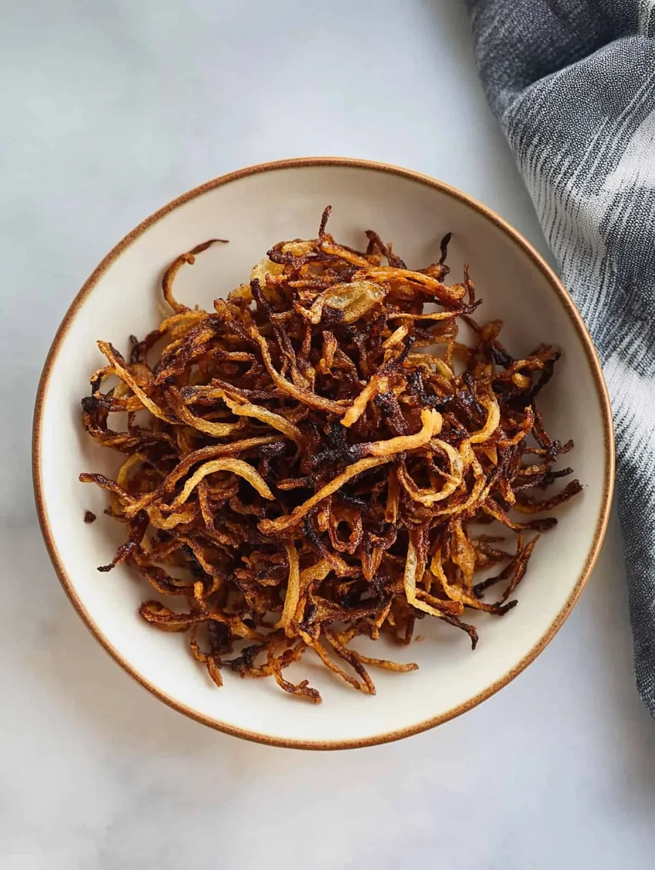 A bowl of fried onions.