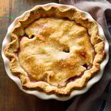 A pie in a white bowl.