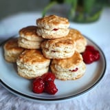 A stack of biscuits with jelly on top.