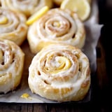 A plate of pastries with lemon and sugar.
