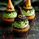 Three cupcakes with witch hats on top.