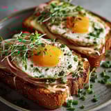 A croque madame with eggs and ham.