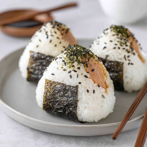 Three pieces of Japanese tuna onigiri.