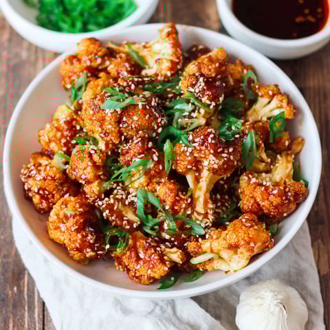 A bowl of cauliflower with sesame seeds.